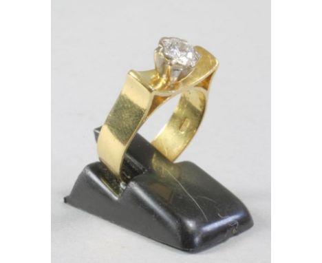 A MODERN SOLITAIRE DIAMOND RING, the collet set stone of approximately 0.5cts to a concave panel and plain wide 18ct gold sha