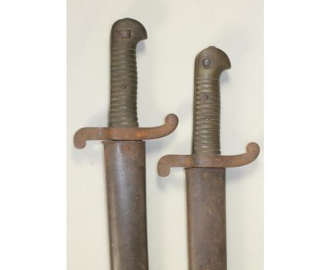 AN M1842 FRENCH BAYONET, the 22 1/2" blade dated to 1842, brass hilt and steel scabbard, together with a similar bayonet, the