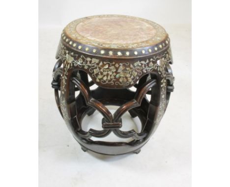 A CHINESE PADOUK STAND, c.1900, of circular form and inlaid with mother of pearl flowers and trailing foliage, beaded edged i