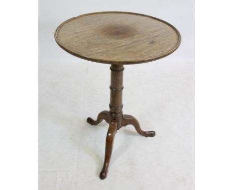 A MAHOGANY TRIPOD TABLE, 18th century and later, the associated dished circular tip up top on ring and baluster turned stem, 