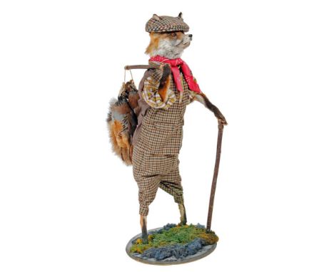 A STUFFED FOX, standing and dressed in a tweed flat cap, waist coat and plus fours, walking stick in one paw and a brace of p