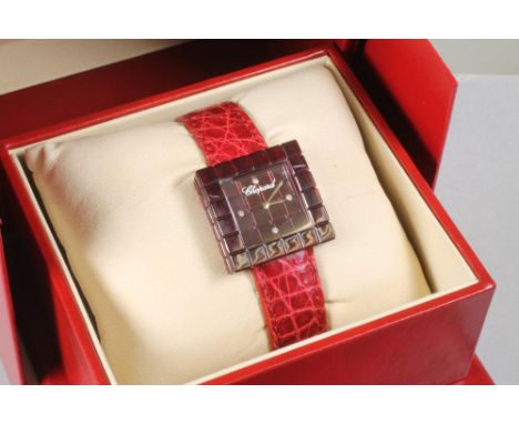 "BE MAD" - a Chopard limited edition quartz wristwatch, the chequered square red resin dial inset with four diamond quarter m