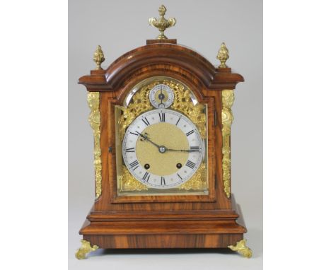 A MAHOGANY AND ORMOLU CASED MANTEL CLOCK, the twin barrel movement stamped R.M.S. and quarter striking on a gong, 6 3/4" arch