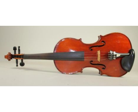 A GERMAN TRADE VIOLIN, late 19th century, with 356mm two piece back, label inscribed "Varnished by B. Reed, Hedley Hill, 1890