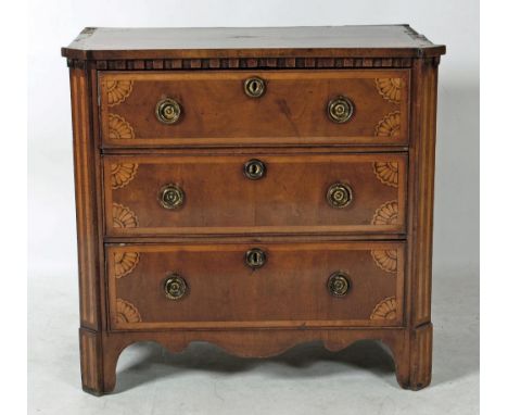 A NORTHERN EUROPEAN MAHOGANY AND MARQUETRY INLAID COMMODE, 18th century, the carved and banded top with central shell patera 