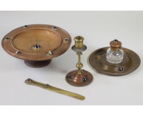 A VICTORIAN GOTHIC REVIVAL MATCHED FOUR PIECE DESK SET in copper and brass, comprising dished inkstand engraved with a presen