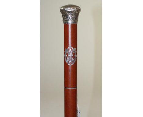 A MALACCA SWORD STICK, late 19th/20th century, with 27 1/2" fullered triangular section blade, handle with inset white metal 