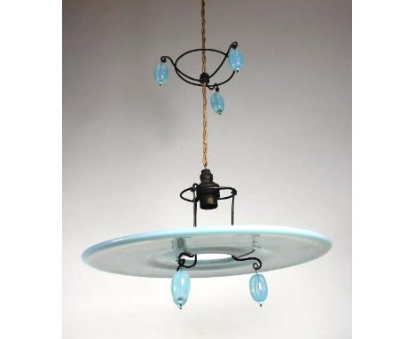 AN ART DECO BLUE OPALESCENT GLASS LIGHT FITTING, the flat disc shade supported on a scrolled two tier wire fitting pendant wi