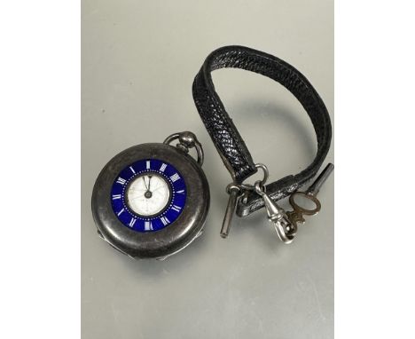 A Edwardian ladys silver half hunter fob watch with blue enamel outer ring to case with roman numerals and inner enamel dial 