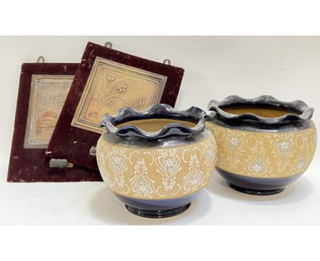 A pair of velvet backed sconces (one missing holder) with embossed panel designs of flowers and a sunset (h- 36cm), together 