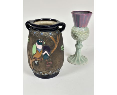 A Austrian Amphora pottery twin handled impress vase of tapered form with enamel parrot,&nbsp; flowers and beaded design impr