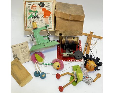 A group of vintage toys comprising two Pelham Puppets (ostrich and a child), a Mamod-type steam engine (boxed), and a boxed '