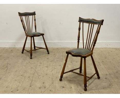 A pair of Arts and Crafts period stained beech and walnut side chairs, with serpentine crest rail and seat upholstered in stu
