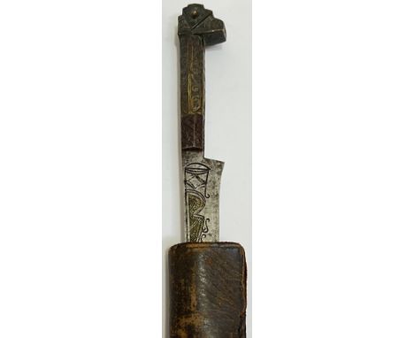 A North African Flyssa long knife with leather/hide scabbard, the blade with engraved design in iron/steel with a carved wood