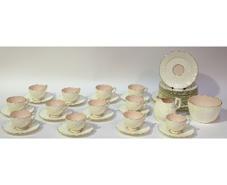 A near complete pink and white floral shaped tea service with gilt decoration comprising, twelve tea cups, twelve saucers, a 