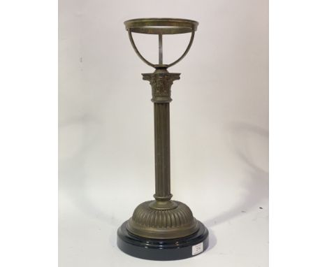 An Edwardian cast brass Corinthian columnar oil lamp base, with later lustre style glazed ceramic vase. H53cm.&nbsp;