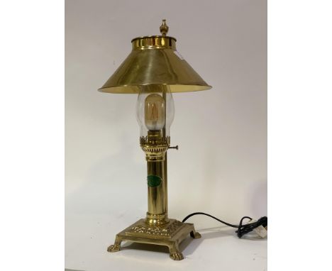 A vintage brass table lamp formed as an oil lamp, with badge reading 'Paris Istanbul, The Orient Express.' H52cm.