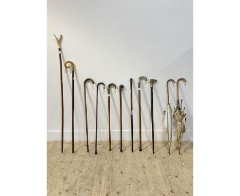 A collection of five vintage walking sticks, including some with white metal or silver mounts etc... (5)