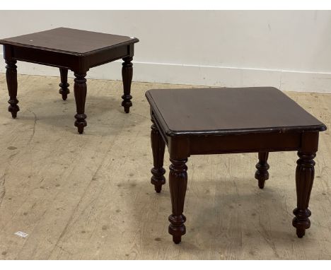 A pair of Victorian style mahogany lamp tables, each with square top above baluster carved and reeded supports. H47cm, W60cm,