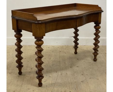 A Victorian mahogany and walnut serpentine console table, the galleried top above two frieze drawers, raised on well turned s