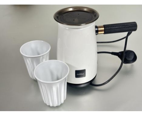 A Hotel Chocolat hot chocolate velvetiser set in unused condition in white enamel and bronzed metal finish handle compete wit