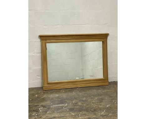 A contemporary light oak framed over mantel mirror. 120cm x 90cm.&nbsp;