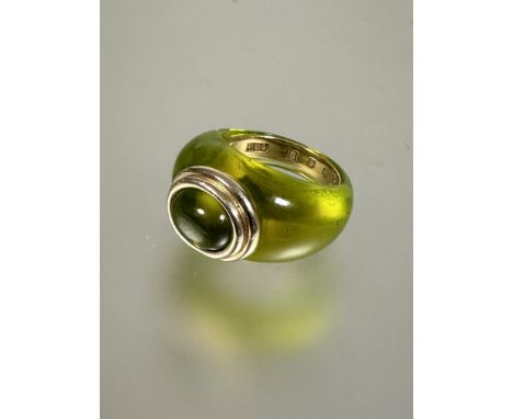 A&nbsp; R L Christie of Edinburgh hand made gold mounted peridot green resin bombe ring set oval peridot cabochon set in gold