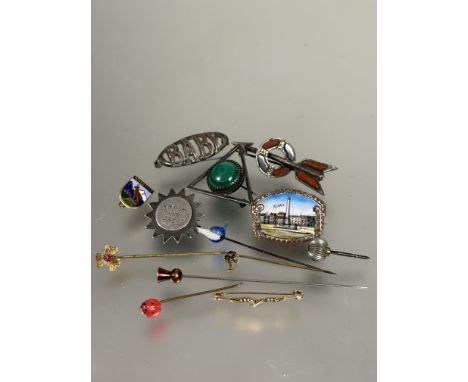 A collection of six various white metal, silver and gilt metal brooches, two with enamel designs, a malachite set triangular 