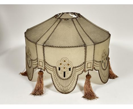 A vintage 1920s waxed plastic standard lamp shade of scalloped stitched paneled design with alternating original tassels show