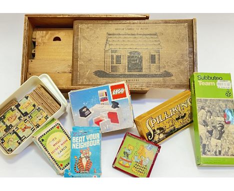 A quantity of vintage toys comprising a boxed wooden four horse stable to build, a boxed Subuteo football eleven (Liverpool),