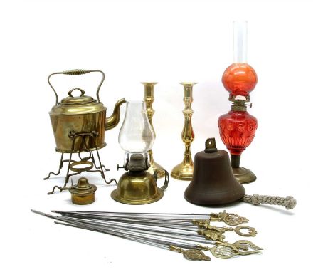 An Arts and Crafts brass spirit kettle, together with other metalware and a cranberry glass oil lamp