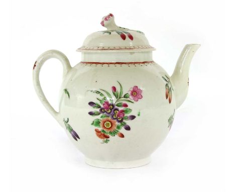 An 18th century English porcelain teapot and cover, painted with flowers. 14.5cm high