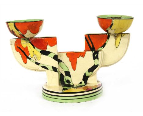 A Clarice Cliff 'Honolulu' 609 double candlestick, both sconces restored, pinned, cracks, 13cm high
