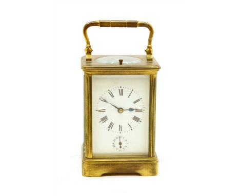 A brass cased carriage clock with repeater movement, having white enamel dial and black Roman numerals, 16.5cm high