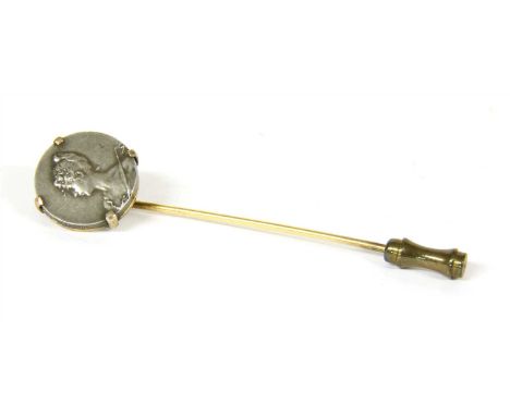 A Continental gold stick pin with an Art Nouveau medallion claw set in the top , with 4.51g, a box by Gabr Baitensperger Gold