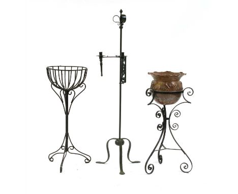 A wrought iron twin sconce candle light, a similar log basket and a wrought iron stand with open basket
