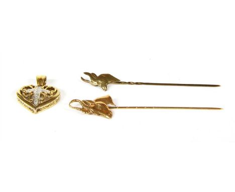 Two gold Springbok stick pins, marked 9ct, two sterling silver pierced vine leaf decanter labels, London 1826, for port and s