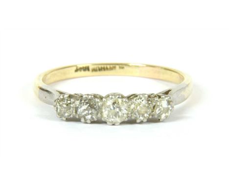 A graduated five stone diamond ring with Swiss cut diamonds , claw set to a white head with a yellow shank, marked 18ct PLAT,