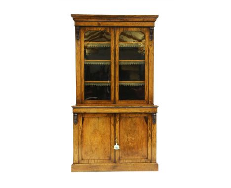 A Victorian rosewood and inlaid bookcase, with two glazed doors over a panel door base, 118cm x 46cm x 211cm