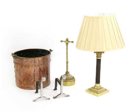 A brass Corinthian column table lamp, with shade, a brass doorstop, a pair of small fire dogs, a copper basket, and four wick