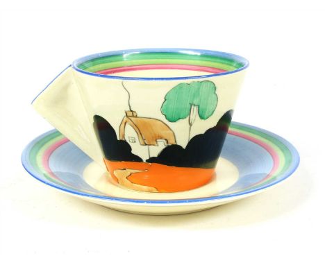 A Clarice Cliff 'Crinoline Lady' pattern tea cup and saucer