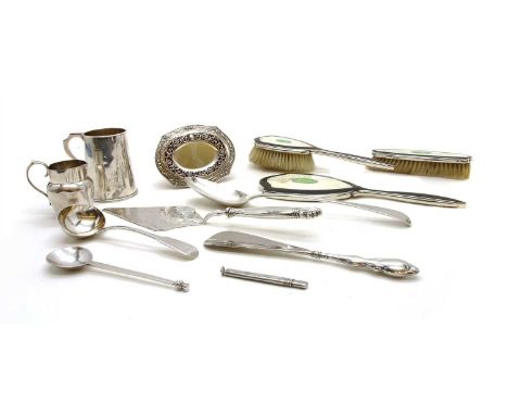 A collection of silver items, to include a George III basting spoon, London 1797, a similar Georgian ladle, a pencil holder b