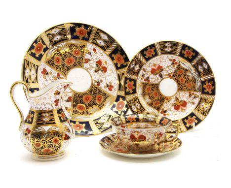 A Derby porcelain tea service, decorated in the Imari palette, heightened in gilt