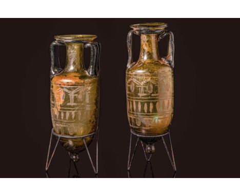 Egypt or Eastern Mediterranean, Ca. 4th century AD. A pair of olive green glass amphoriskoi, each with dark bluish-green hand