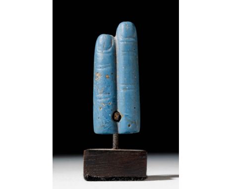 Late Period, Ca. 664 - 332 BC. A glass amulet in the form of two extended fingers, each rendered with incised lines marking t