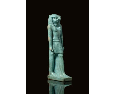 Late Period to Ptolemaic Period, Ca. 664 - 30 BC. A turquoise faience amulet of Horus depicted standing on a rectangular base