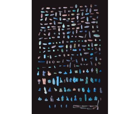 Ca. 1550 - 30 BC. A large collection of faience beads and amulets, including predominantly tubular and spherical beads in blu