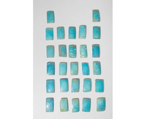 Old Kingdom, Ca. 2686 - 2181 BC. A collection of 27 rectangular faience tiles, each with a slightly convex upper face, coated
