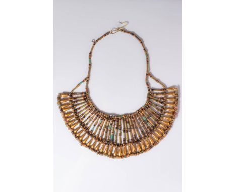 New Kingdom, Ca. 1550 - 1069 BC. A broad collar composed of multiple rows of tubular faience beads in green, blue, and earthl