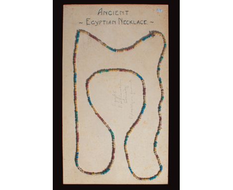 New Kingdom, Ca. 1352 - 1336 BC. A polychrome glazed frit mummy bead necklace, composed of disc-shaped beads in alternating h